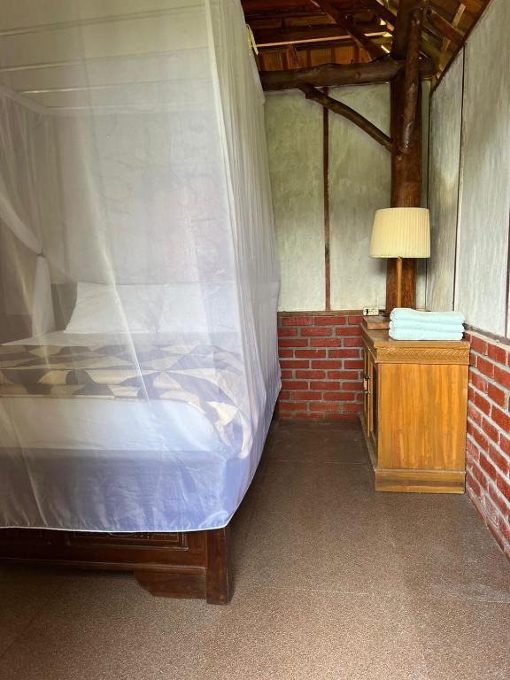 Postel nebo postele na pokoji v ubytování Cabin D Bendul and Warung