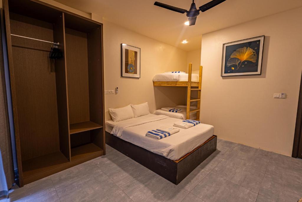 Postel nebo postele na pokoji v ubytování Bibee Maldives