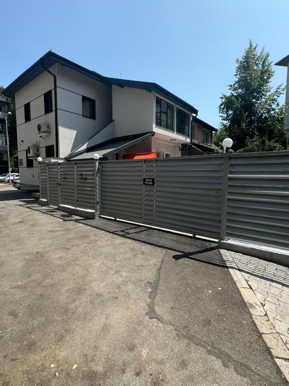 a metal fence in front of a house at Luxurious House with Deluxe rooms & Free Secured Parking in Sofia