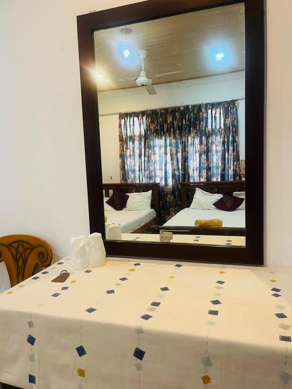 Postel nebo postele na pokoji v ubytování Suisse View Residence Kandy