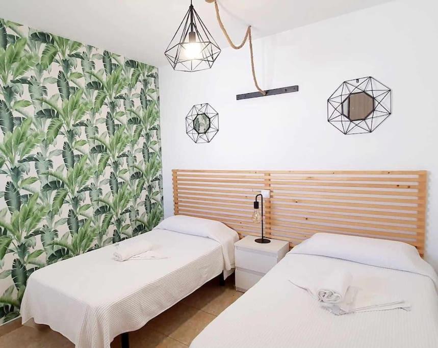 Postel nebo postele na pokoji v ubytování Vivienda Vacacional Hábitat Tropical