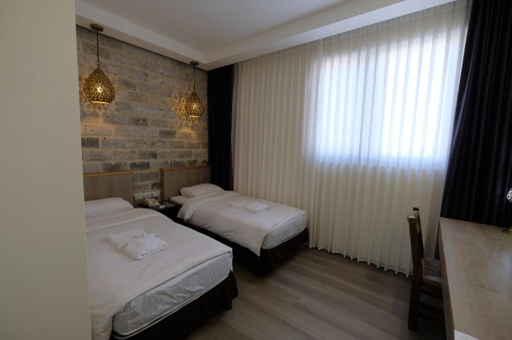 Voodi või voodid majutusasutuse St. George’s Cathedral Pilgrim Guesthouse – Jerusalem toas