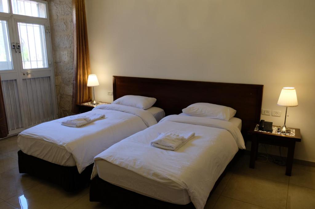 Voodi või voodid majutusasutuse St. George’s Cathedral Pilgrim Guesthouse – Jerusalem toas