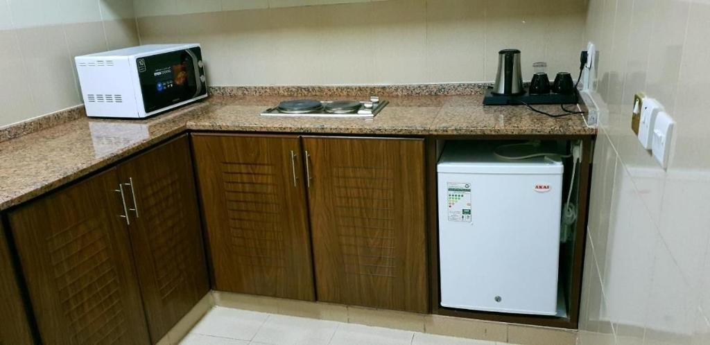 Kuchyň nebo kuchyňský kout v ubytování Al Jimi Plaza Hotel