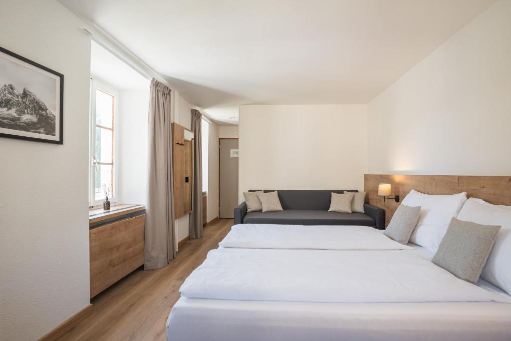 Postel nebo postele na pokoji v ubytování Hotel Brocco & Posta