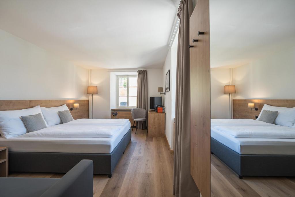 Postel nebo postele na pokoji v ubytování Hotel Brocco & Posta