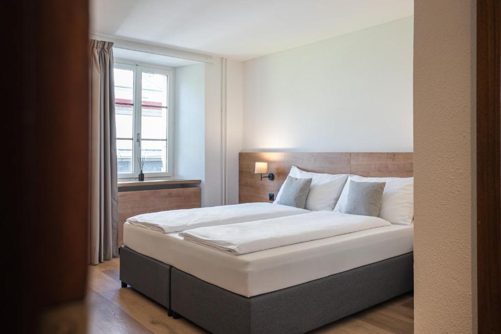 Postel nebo postele na pokoji v ubytování Hotel Brocco & Posta