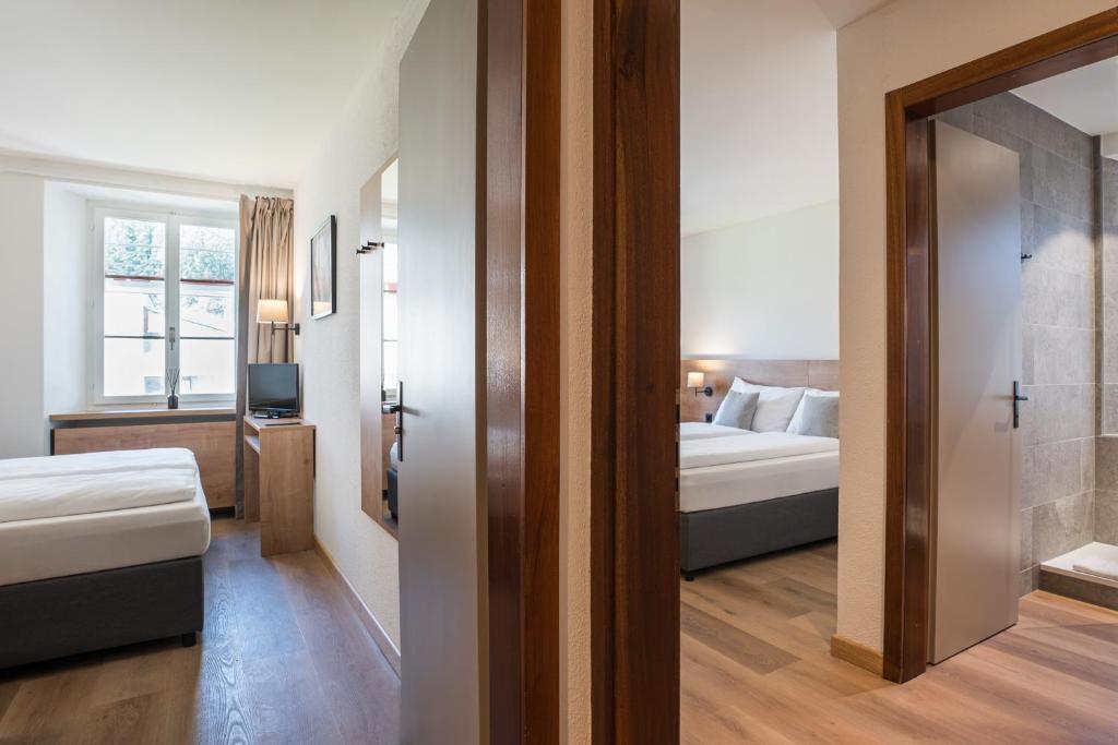 Postel nebo postele na pokoji v ubytování Hotel Brocco & Posta