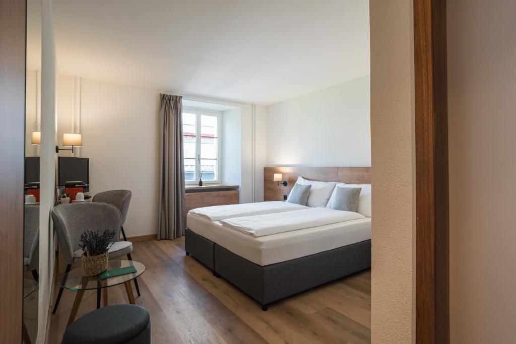 Postel nebo postele na pokoji v ubytování Hotel Brocco & Posta