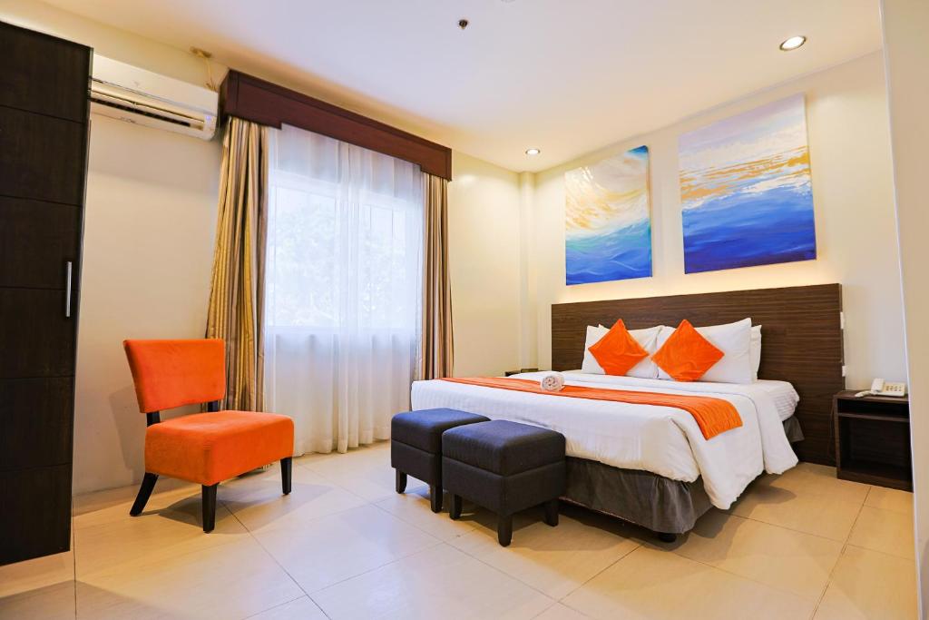 Postel nebo postele na pokoji v ubytování Holiday Suites