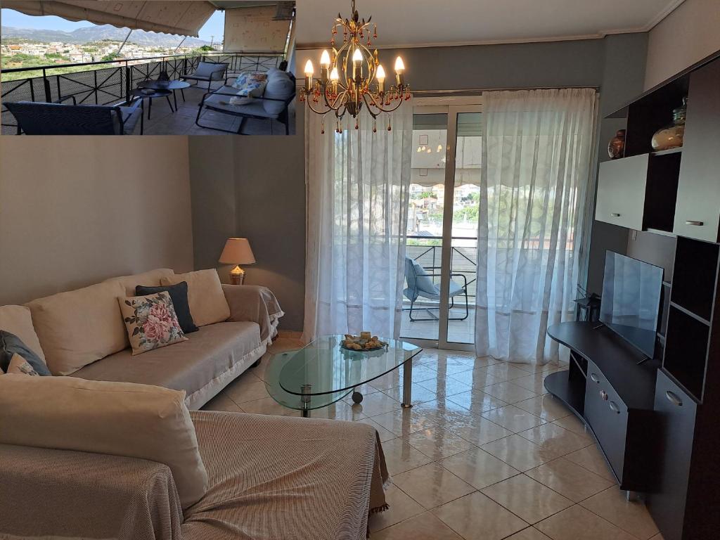 a living room with a couch and a table at Victoria's house in Kalamata
