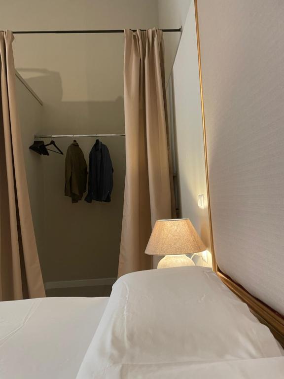 Postel nebo postele na pokoji v ubytování NOTUS Rooms Adults Only