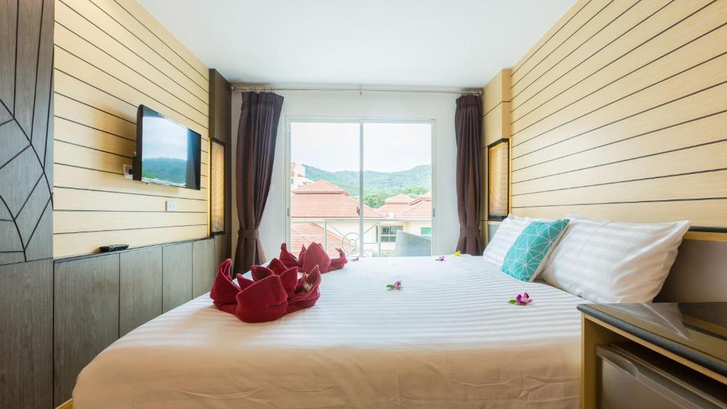 Postel nebo postele na pokoji v ubytování Anda Beachside Hotel