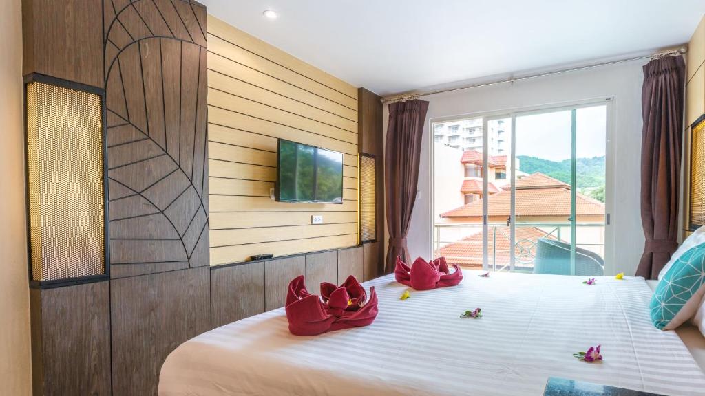 TV a/nebo společenská místnost v ubytování Anda Beachside Hotel