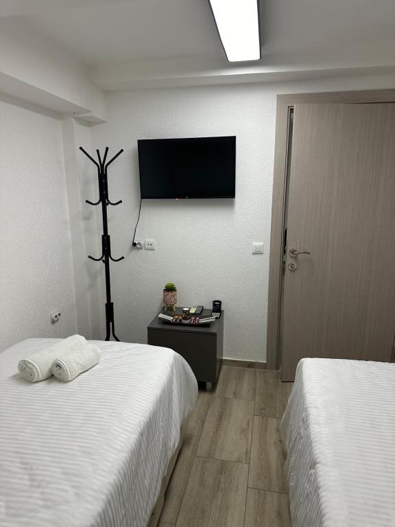 Postel nebo postele na pokoji v ubytování Next Rooms