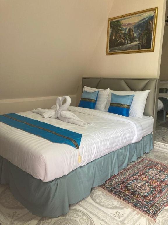 Voodi või voodid majutusasutuse วิวธารารีสอร์ท (ViewThara Resort) toas