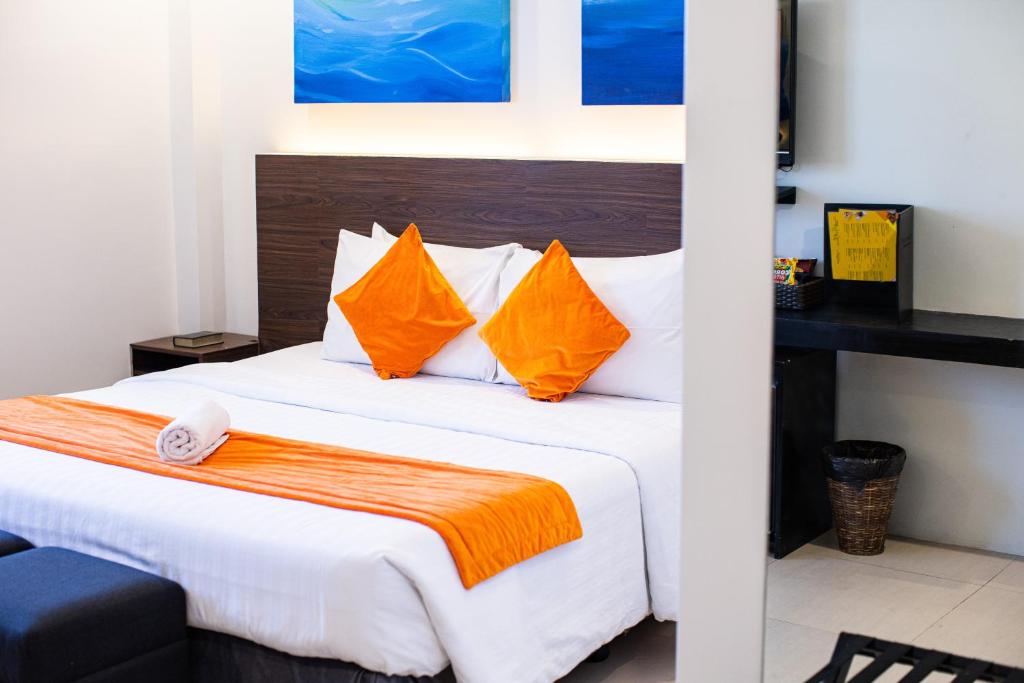Postel nebo postele na pokoji v ubytování Holiday Suites