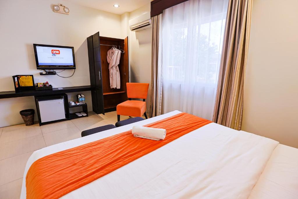 Postel nebo postele na pokoji v ubytování Holiday Suites