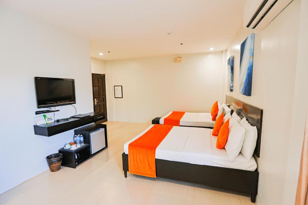 TV a/nebo společenská místnost v ubytování Holiday Suites