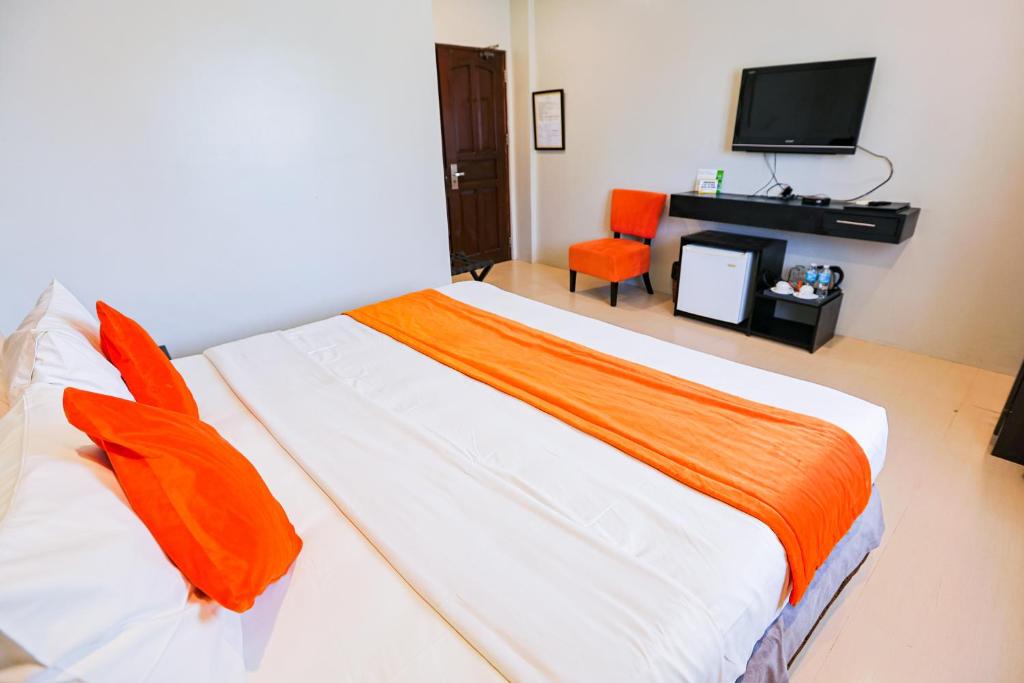 Postel nebo postele na pokoji v ubytování Holiday Suites