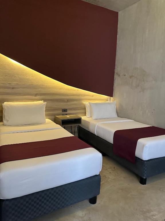 Postel nebo postele na pokoji v ubytování Zenvea Hotel