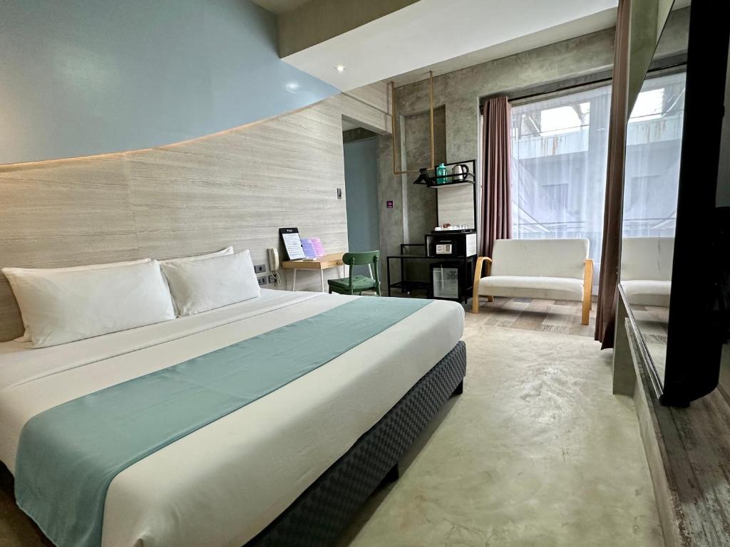 Postel nebo postele na pokoji v ubytování Zenvea Hotel