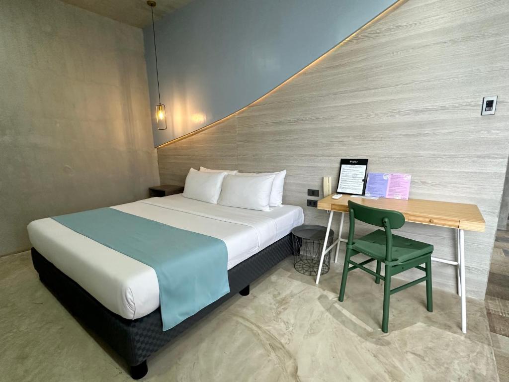 Postel nebo postele na pokoji v ubytování Zenvea Hotel