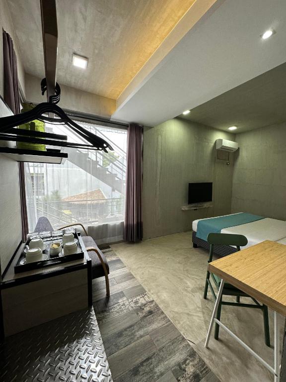 TV a/nebo společenská místnost v ubytování Zenvea Hotel