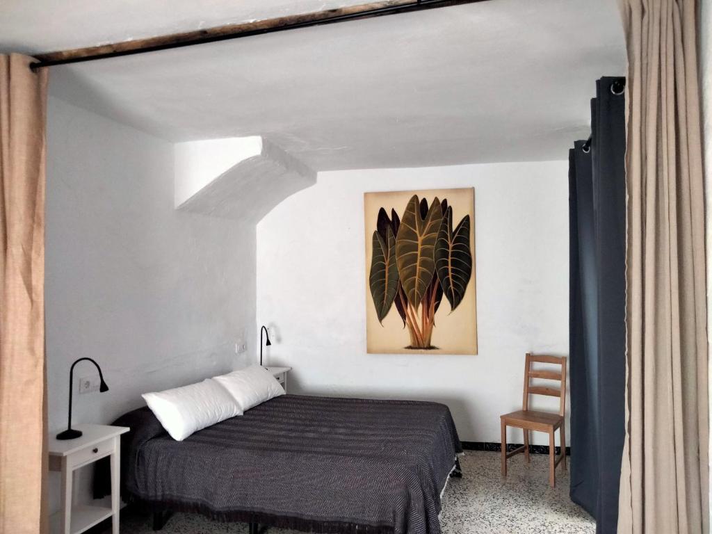 Ένα ή περισσότερα κρεβάτια σε δωμάτιο στο Casa en el casco antiguo