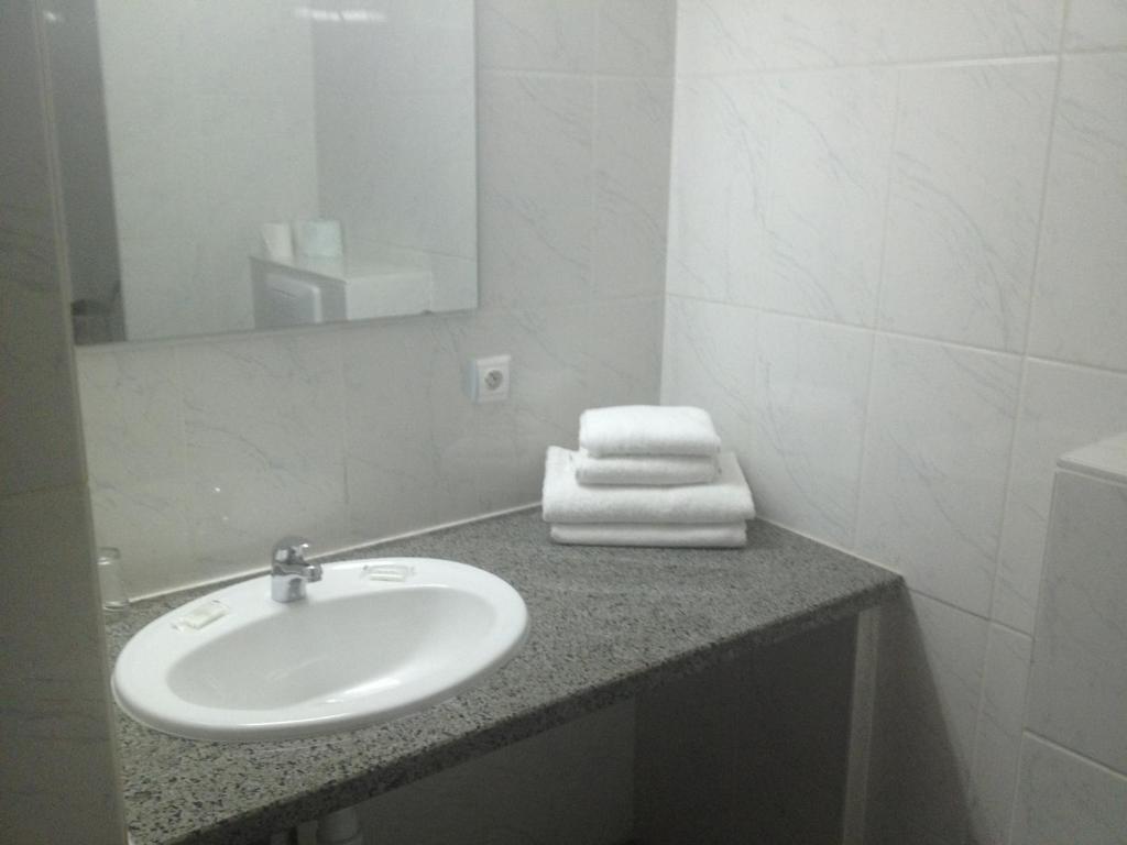Koupelna v ubytování Hotel Le Strasbourg