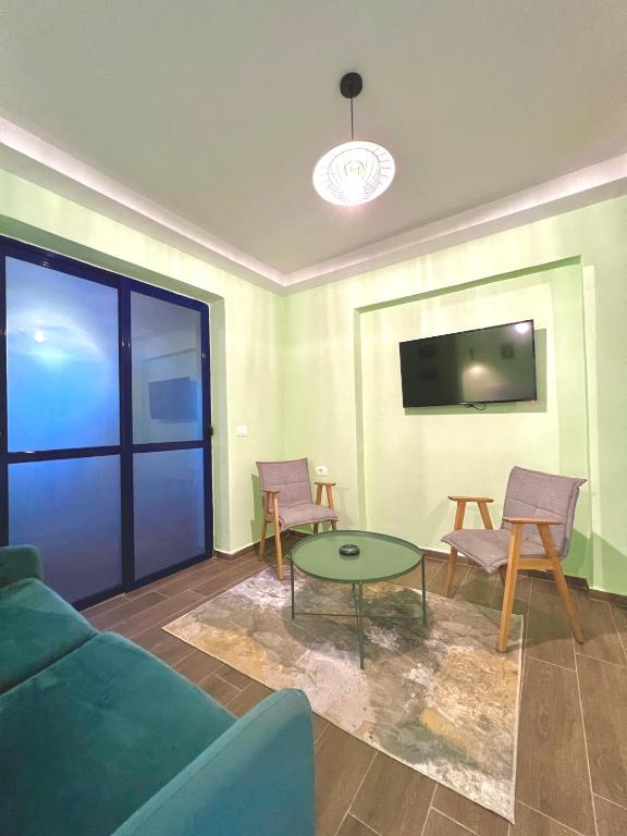 TV a/nebo společenská místnost v ubytování Floridas Beach Suites