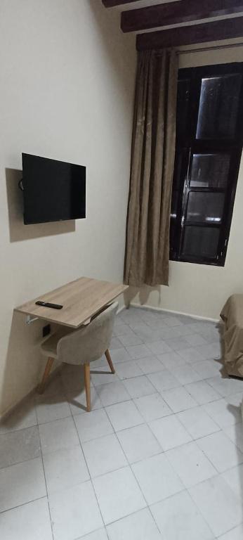 TV a/nebo společenská místnost v ubytování Hotel de Paris