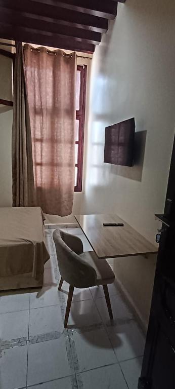 TV a/nebo společenská místnost v ubytování Hotel de Paris