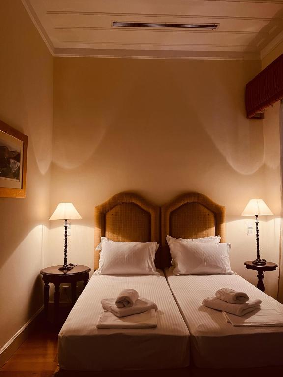Postel nebo postele na pokoji v ubytování The Captain's House Boutique Hotel