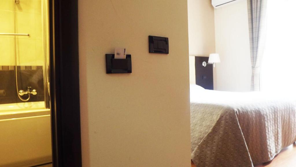 Posteľ alebo postele v izbe v ubytovaní Hotel Nautilus