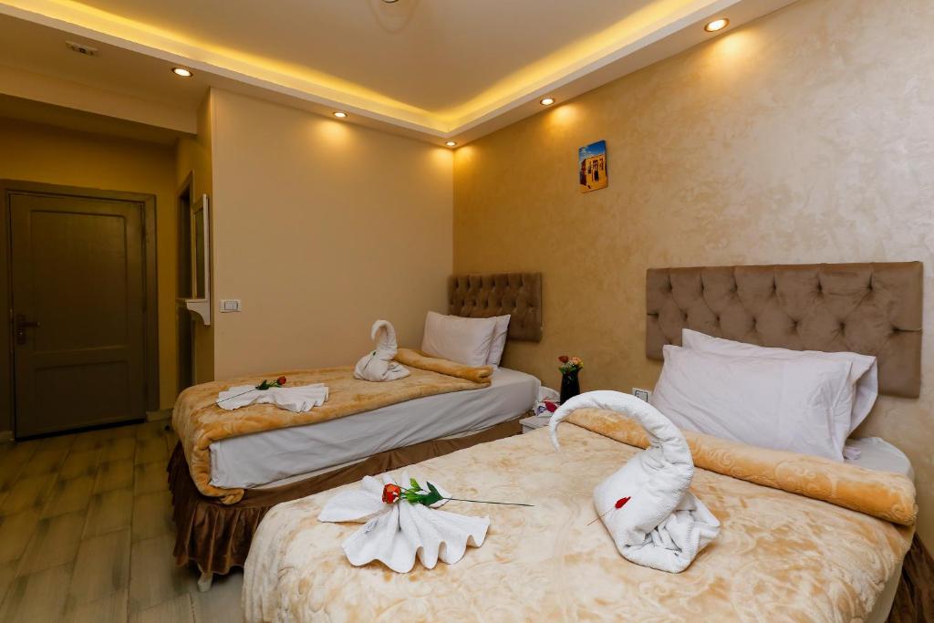 Postel nebo postele na pokoji v ubytování Venus Pyramids-Guest House