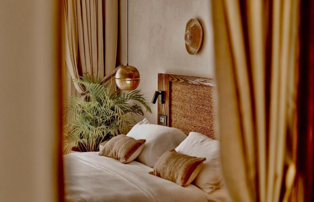 En eller flere senger på et rom på Le Sidi Cabanas hotel serviced