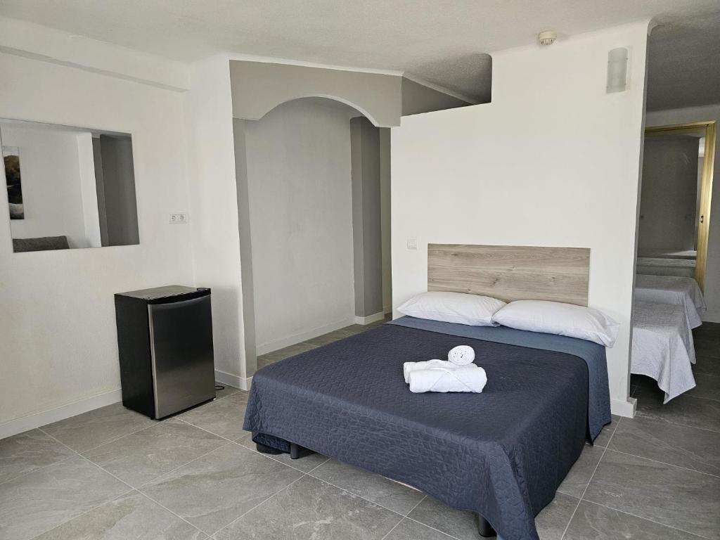 Postel nebo postele na pokoji v ubytování Hotel Velis