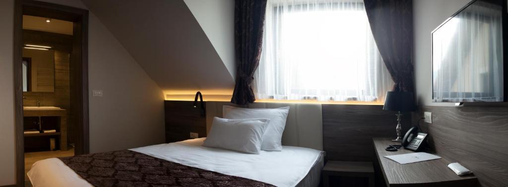 Postel nebo postele na pokoji v ubytování Guesthouse Grof