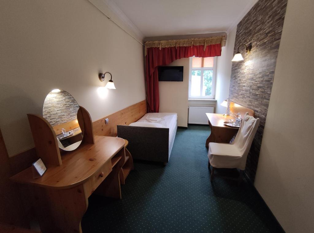 Postel nebo postele na pokoji v ubytování Hotel Atena