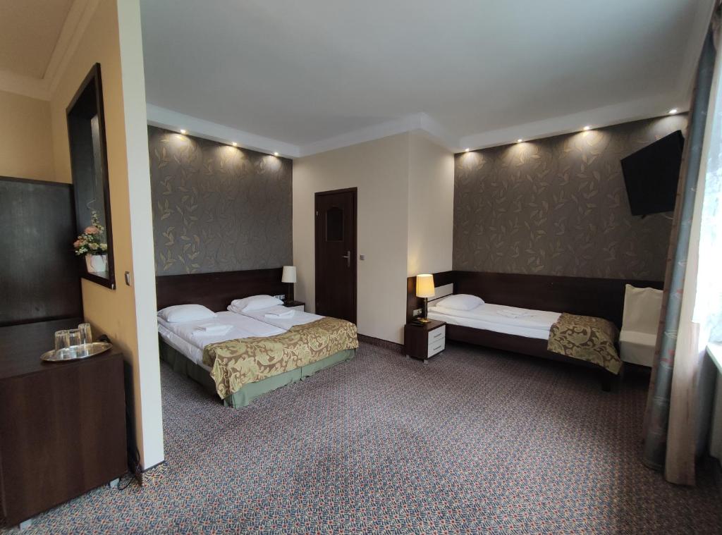 Postel nebo postele na pokoji v ubytování Hotel Atena