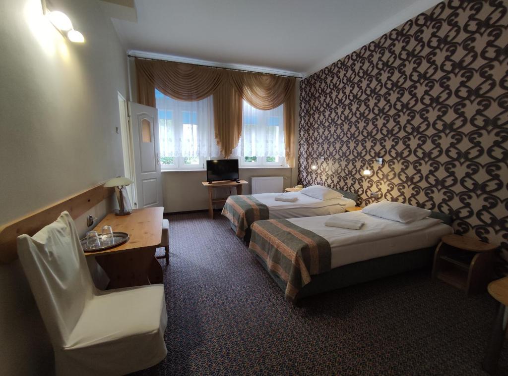 Postel nebo postele na pokoji v ubytování Hotel Atena