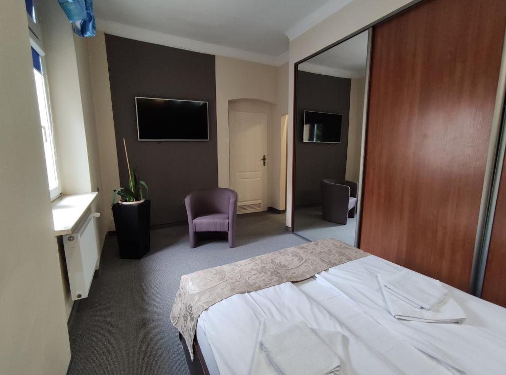 Postel nebo postele na pokoji v ubytování Hotel Atena