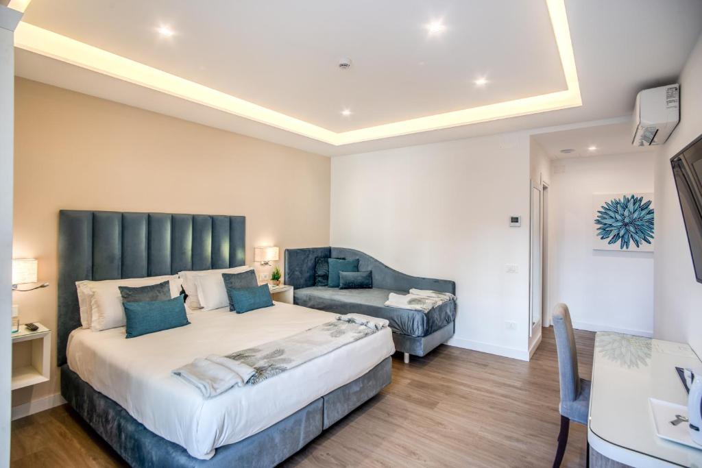 Postel nebo postele na pokoji v ubytování Hotel Sorrento City