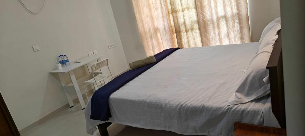 Postel nebo postele na pokoji v ubytování Rockfort stay inn