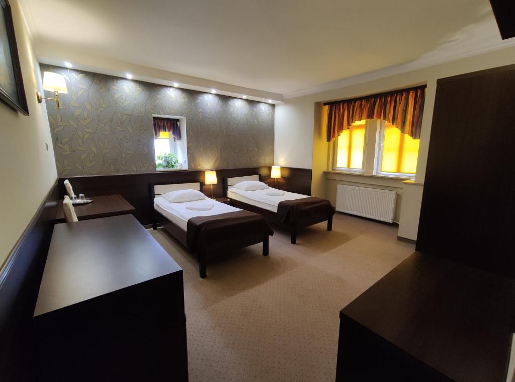 Postel nebo postele na pokoji v ubytování Hotel Atena