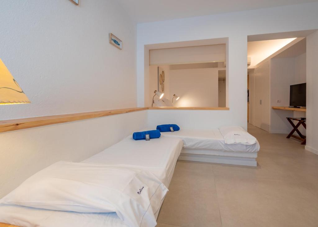 Postel nebo postele na pokoji v ubytování Hotel Calina