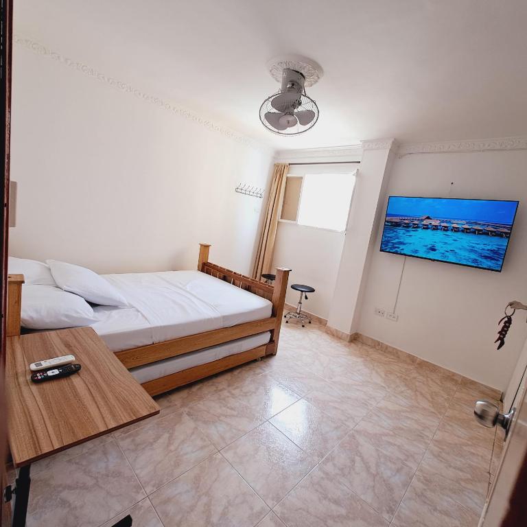 Postel nebo postele na pokoji v ubytování apartaestudios luna azul rodadero