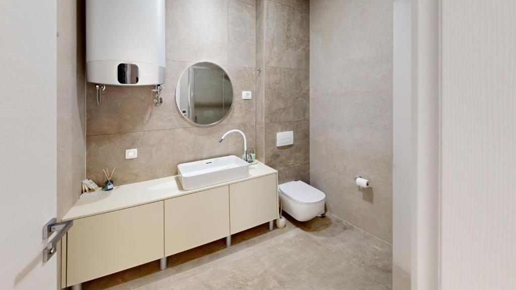 Koupelna v ubytování Calypso Residence
