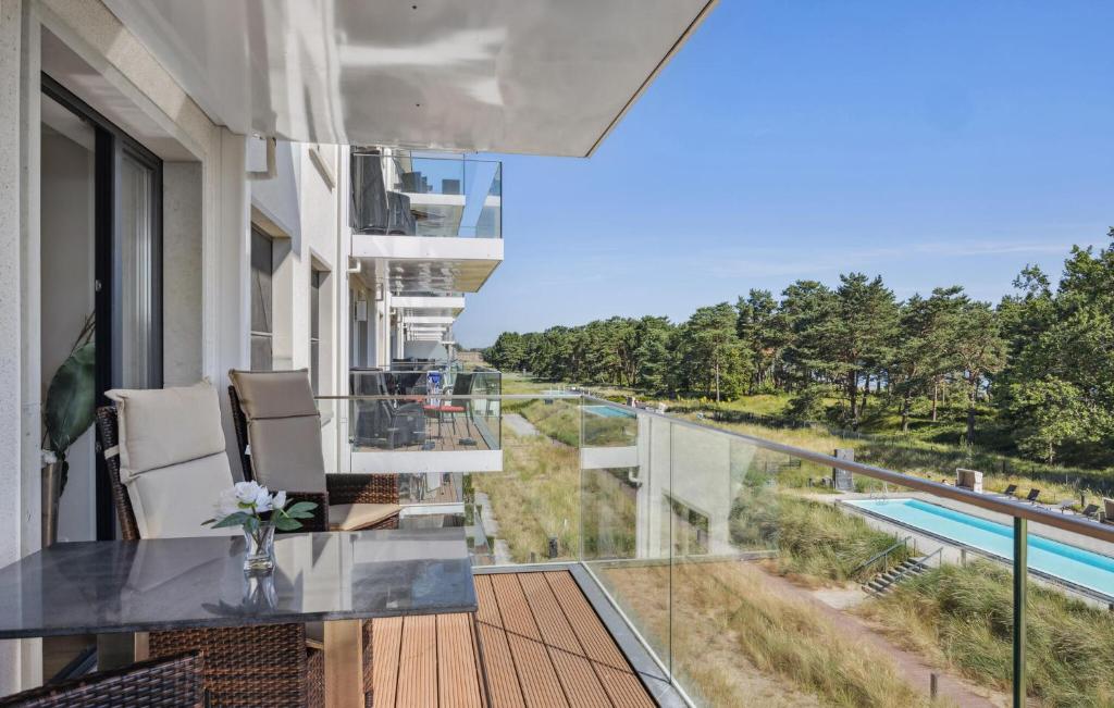 a balcony with a view of a swimming pool at Cloud in Binz